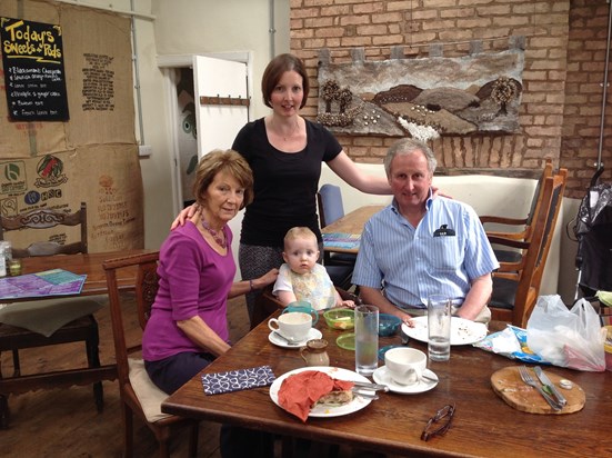Mum, Dad, sister, and nephew having messy lunch on Miles' birthday