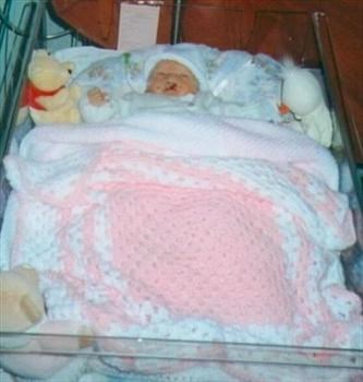 Lucy in her crib x