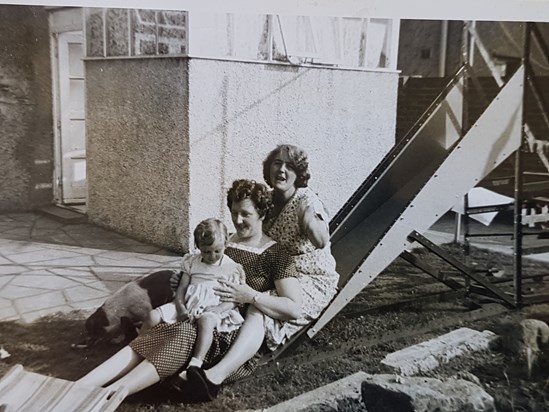 George built a slide in the garden for the children? Nancy and Marion