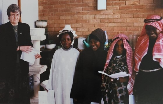 Moira with some Askew Road/ URC Sunday school during one of the Christmas nativity play 