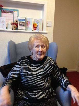 Cathy smiling in the care home