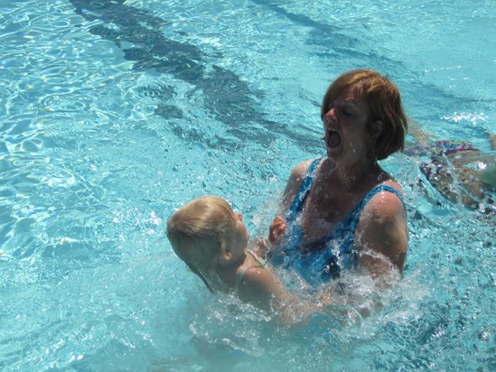 Grandma teaching Astrid to swim