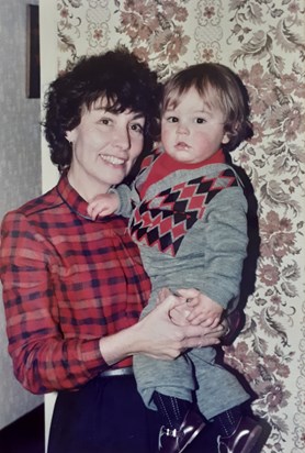 Photo with first grandchild, Daniel, 1982