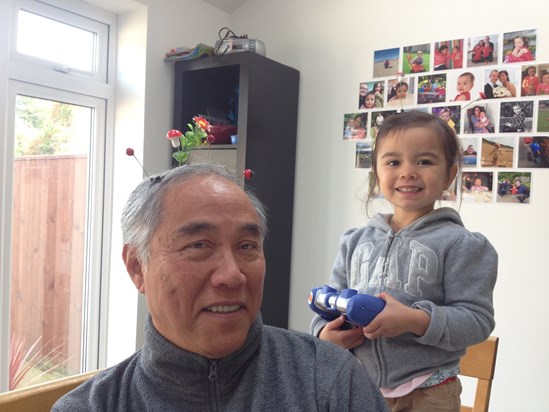 Dad with Caitlyn, doing his hair!