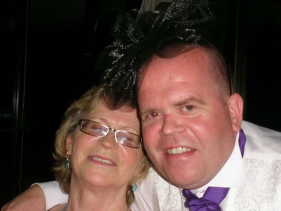Carl with his mum wearing her fascinator because he can!