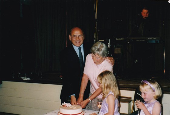 Cutting Anniversary cake with Tony