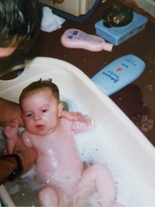 Getting a bath from Daddy 