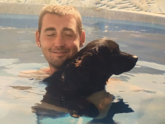 Joel with one of his dogs in Spain.