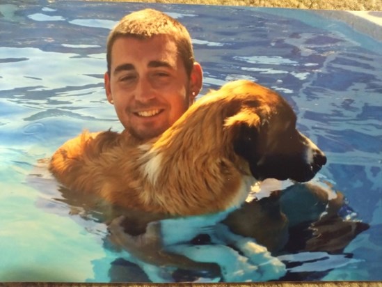Joel with his other dog in Spain.