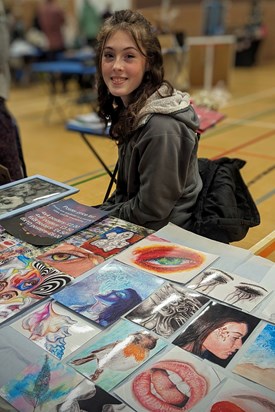 Beautiful Bethany with her art at a Christmas craft fayre.