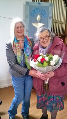 Past President of GGU, Chenda, receiving bouquet from new President, Rose