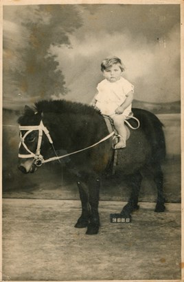 Benny at one year old on donkey in studio - Enfield (1933) 