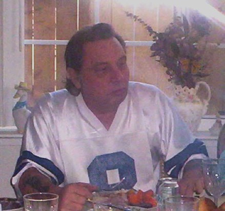 Sporting his cowboys jersey and lookin good doing it.