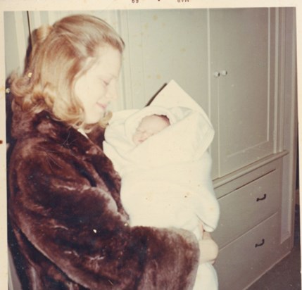Mom holding me shortly after I was born. (David)