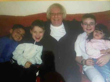 my dad with 4 of his grandkids luke,stephen,nathan and aneesah