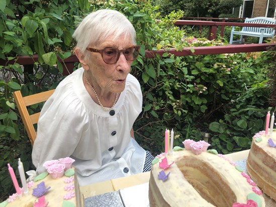 Joyce blows out the candles on her spectacular 100th cake, made by Sandra