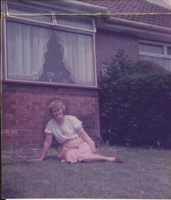 Joyce in her front garden