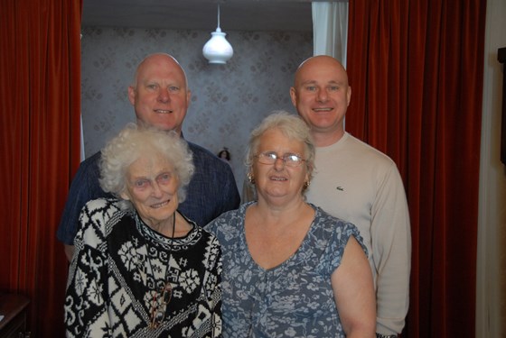 Joyce with her three children on her 85th birthday