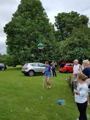 blowing bubbles for Ben at his birthday memorial picnic