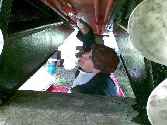 Penny antifouling the boat.  Strangely, I don't miss that job!!