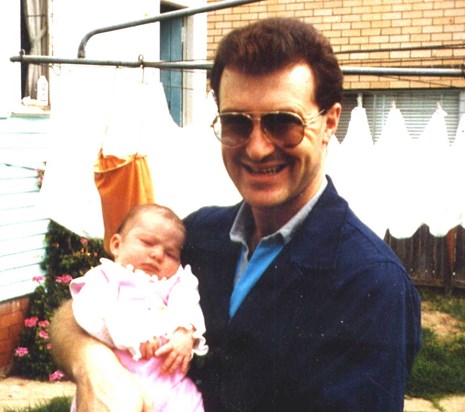 1986_Mark with 2nd cousin baby Phoebe at Nan's.