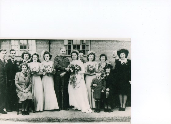 Mavis at Aunty Wynne and Uncle Johns wedding 1945. With her favourite cousin Teddy the other end. God Bless