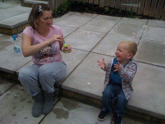 Katie giving Havey his first experience with bubbles!!!