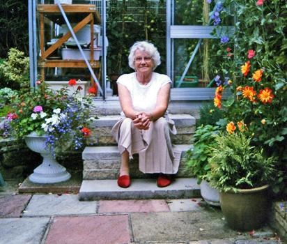 mam sat outside the greenhouse in happier times I think this is my favourite photo of my mam 