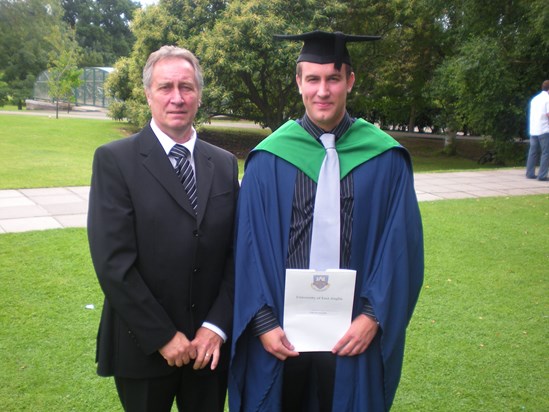 With his eldest son on his graduation day - so proud.