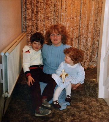 Lynne with children at home