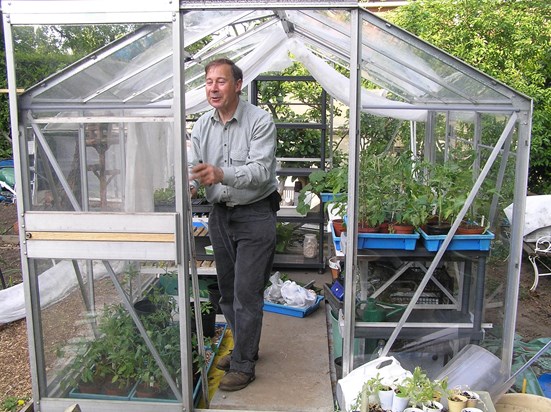 Dad pretending to mend sis’s greenhouse 