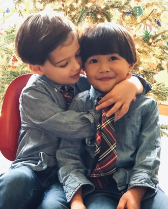 The Grandz are growing up so fast! Reid hugging almost twin Eddie - Christmas, 2020
