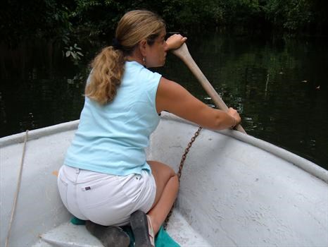 Lisa steering the way down a tribulation in Rio Dulce Guatemala