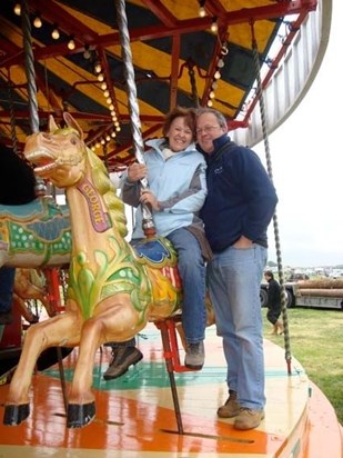 Mum and Dad on their treasured gallopers