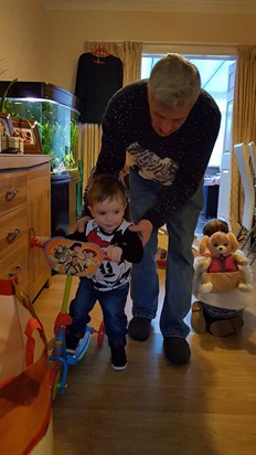 Grandad teaching Tom how to scoot