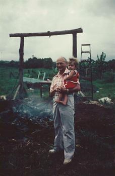 Colin & Grandpa at a pig roast