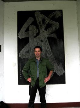 Standing against a famous calligraphy