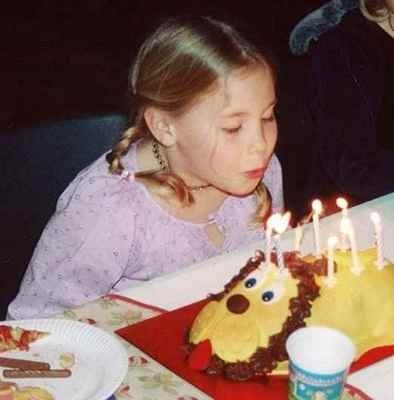 Lucie blowing out candles