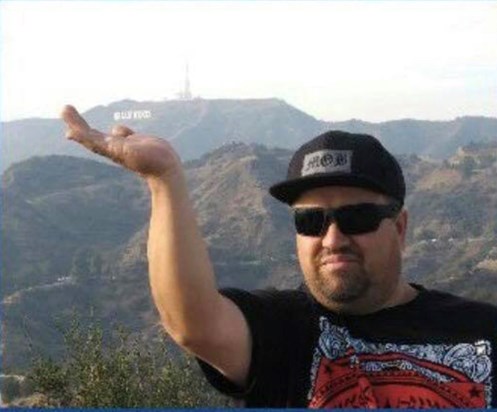 Holding the HOLLYWOOD sign! He was our favorite Comedian 