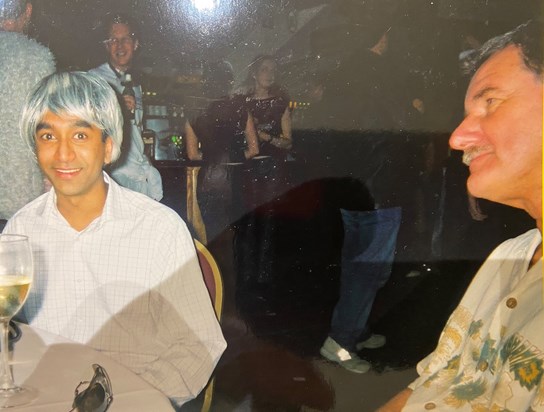 A brilliant picture where I was wearing a wig at a Unilever Xmas fancy dress party and John just looks over at my antics! You were a great leader John