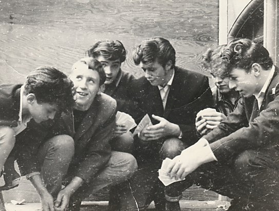 Dad, fourth from left, playing cards with friends, presumably when he was a teenager