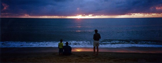 Sunrise at Kewarra Beach, Queensland, Australia. LtoR Troy, Howard, Peter