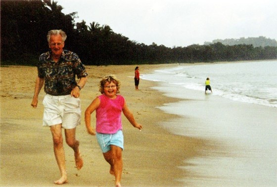 Telita running with Grandpa in Horsham at Cow Bay, Daintree Rainforest, Queensland, Australia