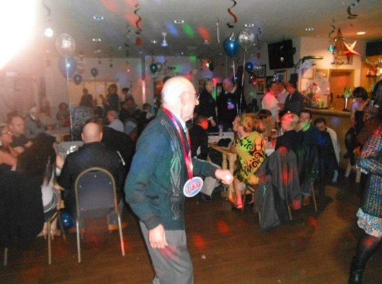 Grandad enjoying a dance at his surprise 80th party