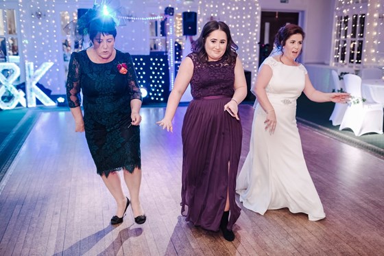 Mother of the bride showing them how it’s done 