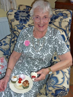 Mum at her happiest with a plate of cakes!