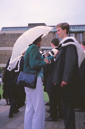A proud mother adjusting Ian's Gown at Cambridge
