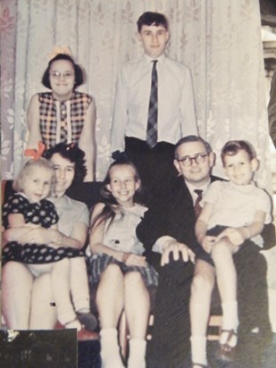 Smiling even at a young age - with mum, dad, John, Jennifer, Andrew and Dorothy