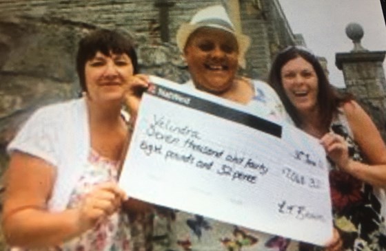 Lesley with her friends and cheques for Velindre