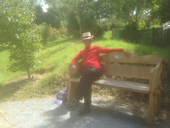 Brian sitting on Terri’s bench at The Garden House. ??